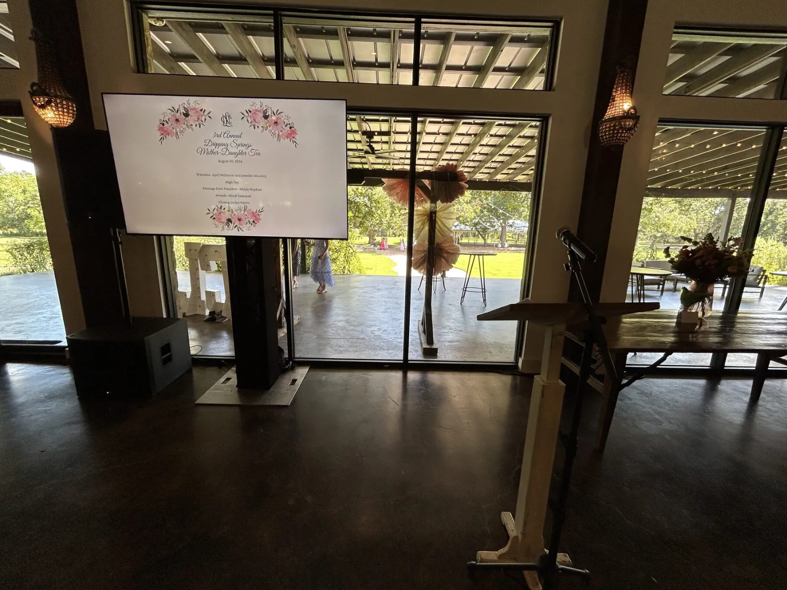 Large display on a black truss stand at an Austin event venue