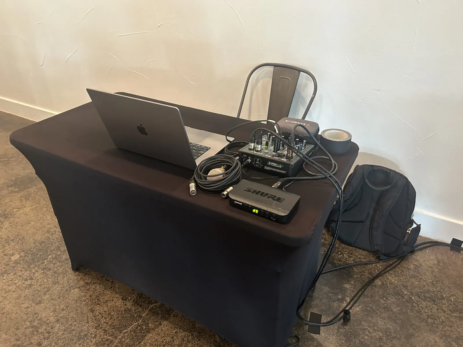 VVP media table with laptop and audio controls at a corporate event