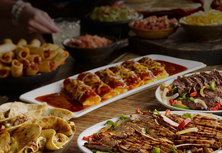 Catering spread of Tex-Mex platters from Chuy's