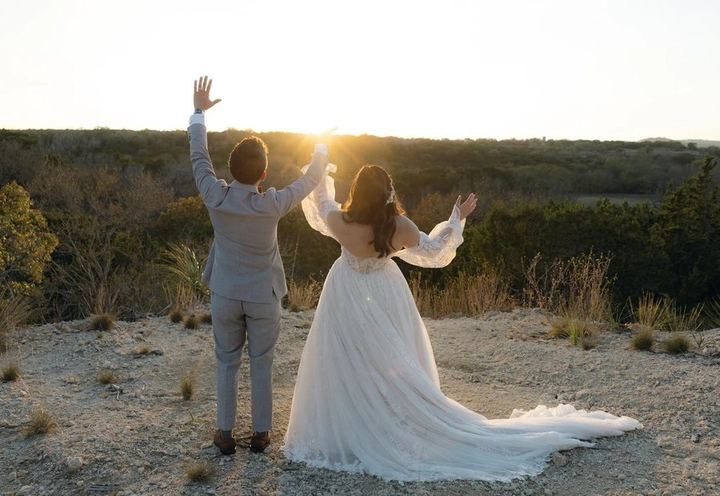 Couple cheering at sunset over the Hill Country, by Jordana Lee Photography