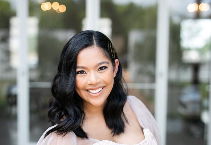 Smiling bride with soft waves, hair and makeup by LoLa Beauty