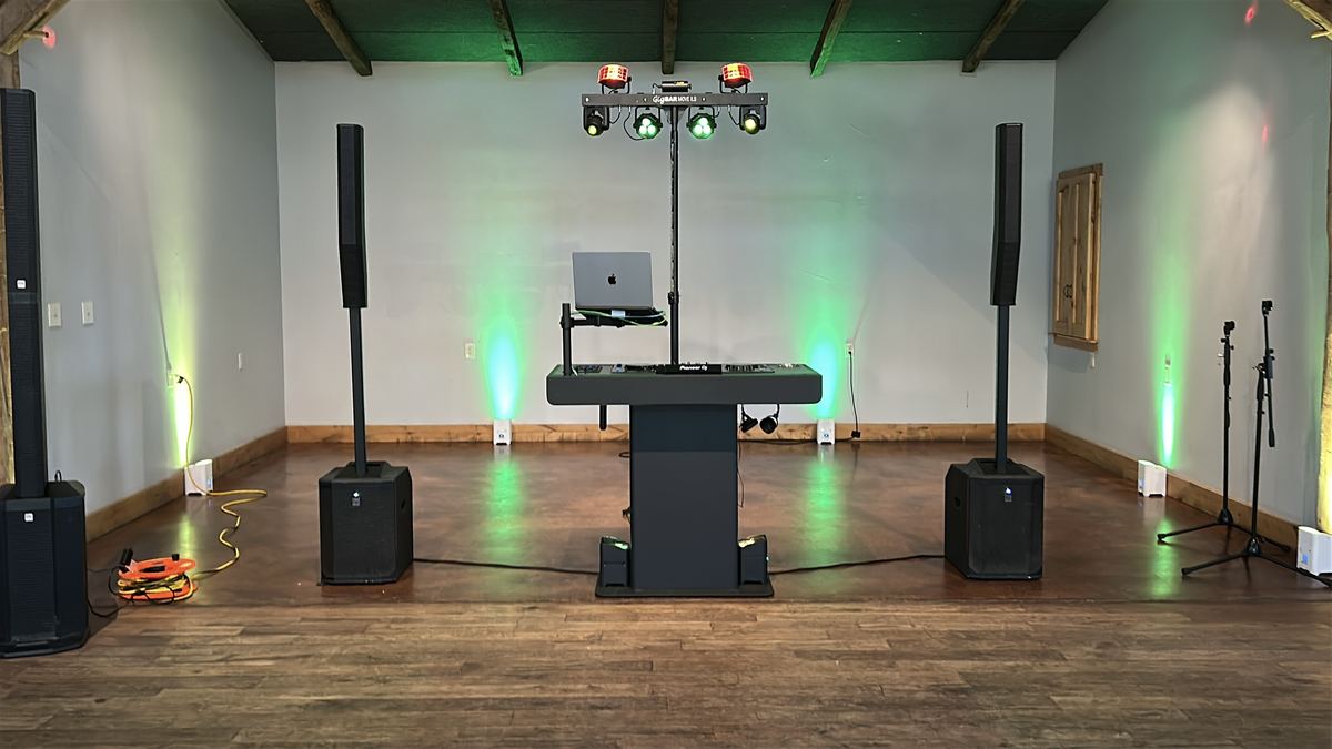 Hall at Camp Lucy washed in green and amber uplighting