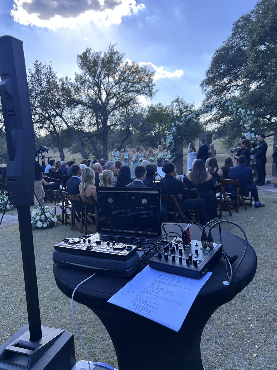 Ceremony sound set up under the live oaks at Ma Maison
