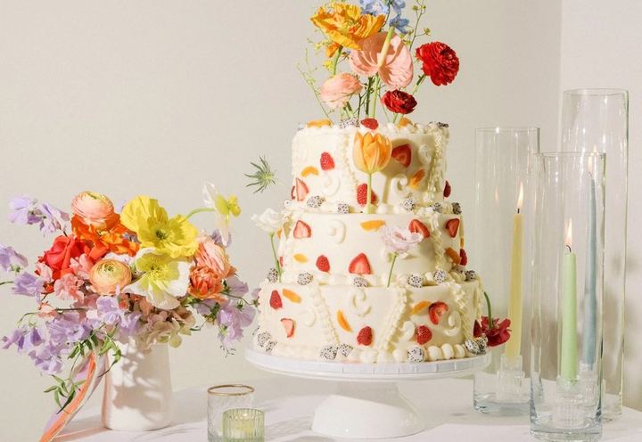 Wedding cake with bright flowers by Sweet Charli Girl